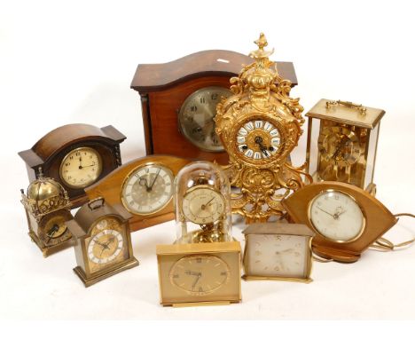 A collection of mid 20th century and later mantel clocks, having manual wind and quartz movements, in two boxes. (2)