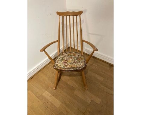 An Ercol blond elm stick back rocking chair, of small proportions, with detachable cushion seat, W62, H84, D70cm.