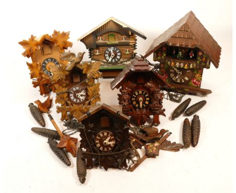 A collection of six mid 20th century Black Forest cuckoo clocks, having single and twin train manual wind movement, in one bo