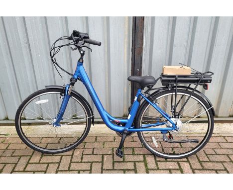 A blue coloured Scenes Glide ladies e-bike with charger and operator manual.