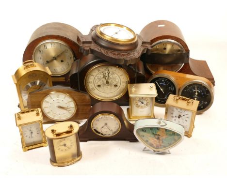 A collection of mid 20th century and later mantel clocks, having manual wind and quartz movements, in two boxes. (2)