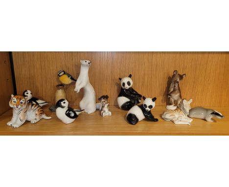 A collection of USSR Lomonosov ceramic models of animals; tiger, badger, stoat, birds, zebra, pandas and bears, stamped USSR 
