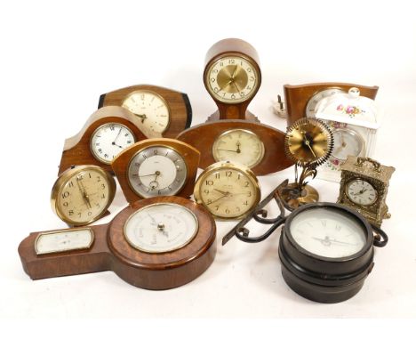 A collection of mid 20th century and later mantel clocks, having manual wind and quartz movements, in two boxes. (2)