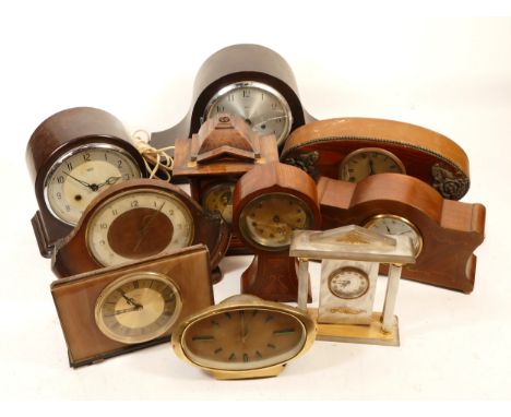 A collection of mid 20th century and later mantel clocks and wall barometers, having manual wind and quartz movements, in thr