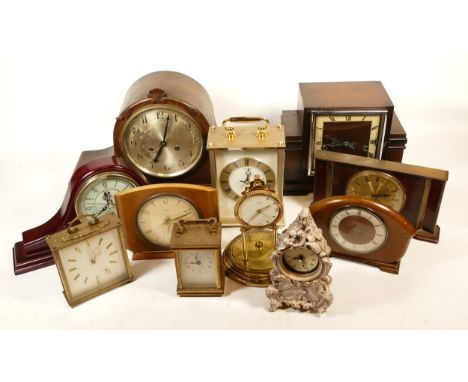 A collection of mid 20th century and later mantel clocks and wall barometers, having manual wind and quartz movements, in thr