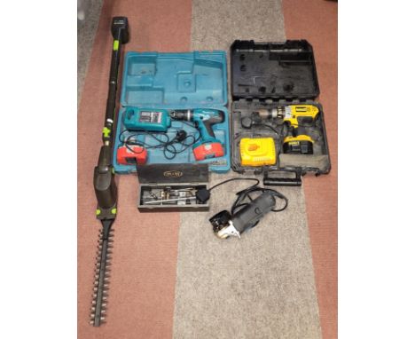 A collection of tools, to include two drills, a Makita and a Dewalt, alongside a GTech Power Blade Pro, amongst others.
