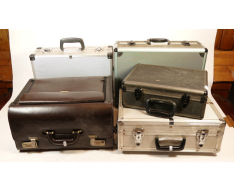 Five camera cases, to include, three hard aluminum cased, and two black cased, one being a large leather briefcase measuring 