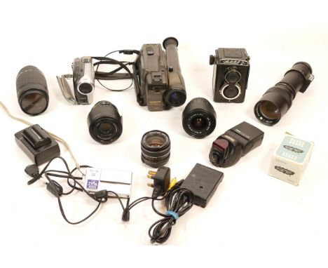A collection of cameras and camera accessories, to include, Sanyo Stereo VM-EX280P, Sony Handycam DCR-DVD202E, Nikon f/4-5.6 