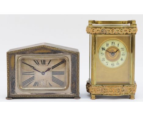A late 19th century French brass carriage timepiece, with applied moulding to the ogee case13cm, together with a French metal