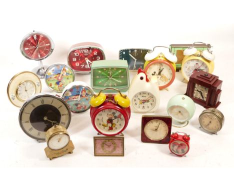 A selection of 20th century mantel clocks, to include novelty bedside alarm clocks, having manual and quartz movements, in on