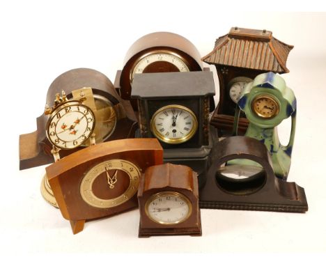 A collection of mid 20th century and later mantel clocks, having manual wind and quartz movements, in two boxes. (2)