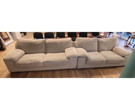 A modern three seater fabric sofa, together with a matching two seater sofa, by Sofology, upholstered in a cream chenille fab