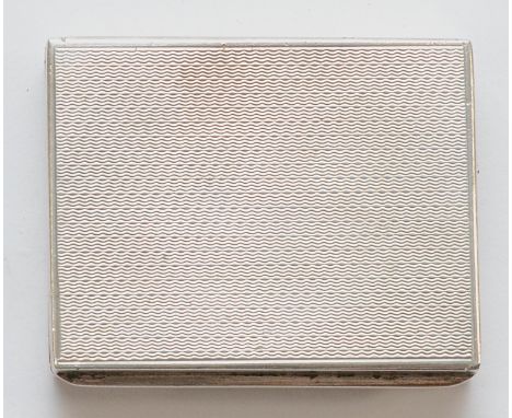 A silver pill box, Birmingham 1948, with engine turned decoration, 5 x 4 x 1cm, 53gm.In very good condition