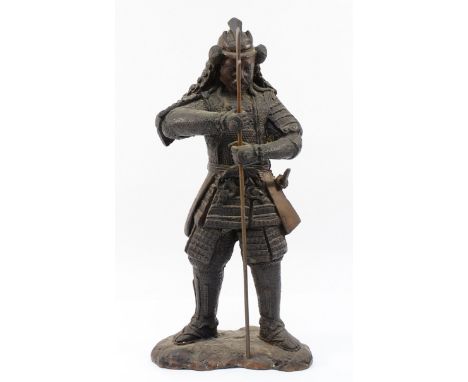 A Japanese bronze of a Samurai warrior, holding an axe spear, apparently unsigned, 46cm