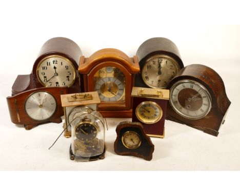 A collection of mid 20th century and later mantel clocks and wall clocks, having manual wind and quartz movements, in three b