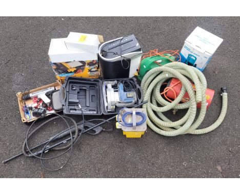 A large power tool collection, including  Performance power pressure washer, timing gun, Plasplugs tile cutter, paper shredde