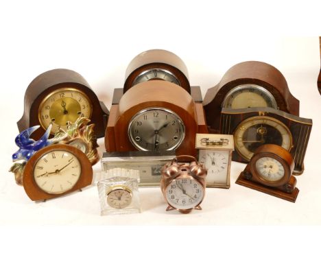 A collection of mid 20th century and later mantel clocks, having manual wind and quartz movements, in two boxes. (2)