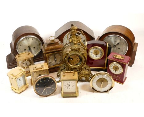 A collection of mid 20th century and later mantel clocks, having manual wind and quartz movements, in two boxes. (2)
