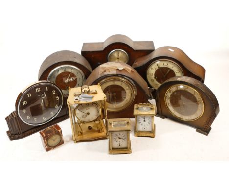 A collection of mid 20th century and later mantel clocks, having manual wind and quartz movements, in two boxes. (2)