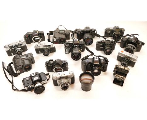 A collection of cameras, to include, Zorki 4K, Minolta 400si, Olympus OM101, Olympus Z-300.