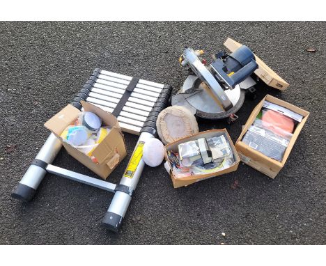 An assortment of chisels, a Titan 240v cross cut saw with blade, aluminium light weight extendable ladder (in need of repair)