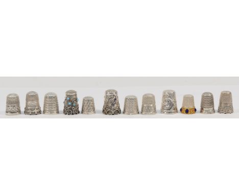 A silver commemorative Charles and Diana wedding thimble, Birmingham 1981, and eleven other silver and unmarked thimbles, 52g
