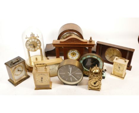 A collection of mid 20th century and later mantel clocks, having manual wind and quartz movements, in two boxes. (2)