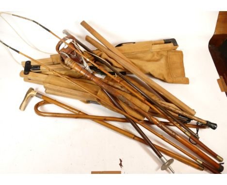 A collection of walking sticks to include one with the collar silver hall marked London 1914 and antler handle, another with 