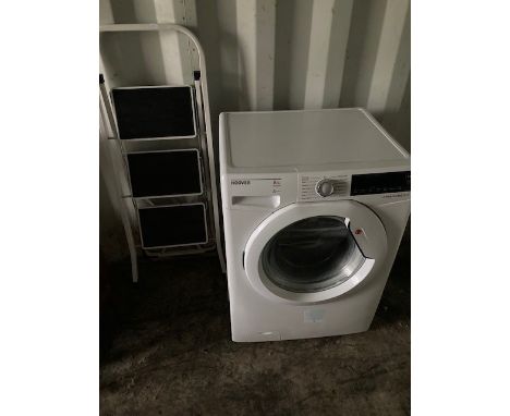 A Hoover 'Dynamic Next' 8kg washing machine, H84, D50, W60cm, together with a three height folding step ladder. (2)