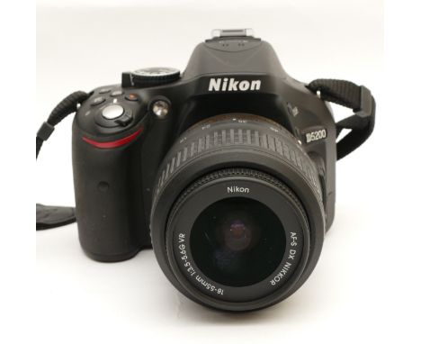 A Nikon D5200 digital SLR camera, with Nikon Nikkor AF-S f/3.5-5.6 18-55mm lens.