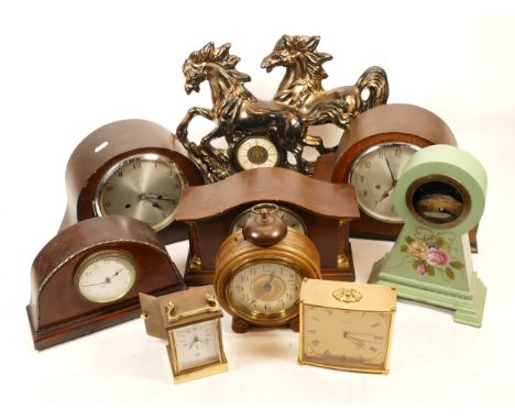 A collection of mid 20th century and later mantel clocks, having manual wind and quartz movements, in two boxes. (2)