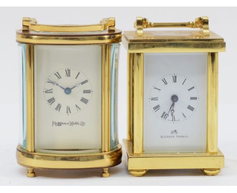 A Mappin &amp; Webb 8 day miniature brass carriage clock, of oval form, boxed with original receipt and key, 9cm tall, togeth