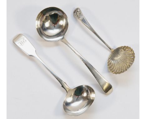 An Edwardian silver shell bowl, pierced and feather edge sifter spoon, Sheffield 1909, a George III silver bottom marked feat