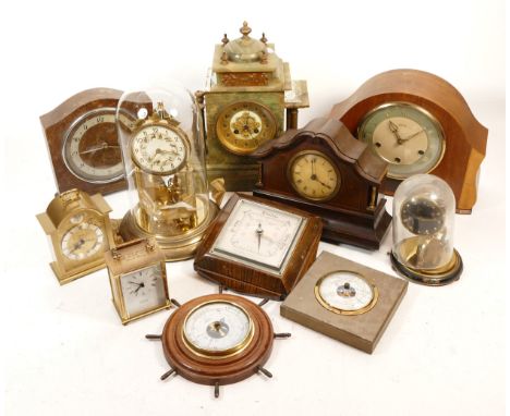 A collection of mid 20th century and later mantel clocks, having manual wind and quartz movements, in two boxes. (2)