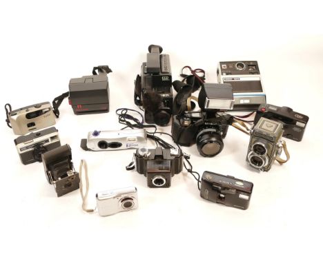 A collection of cameras and camera accessories, to include, Minolta 8 8100 E, Rolleiflex with twin lenses, Schneider-Kreuznac