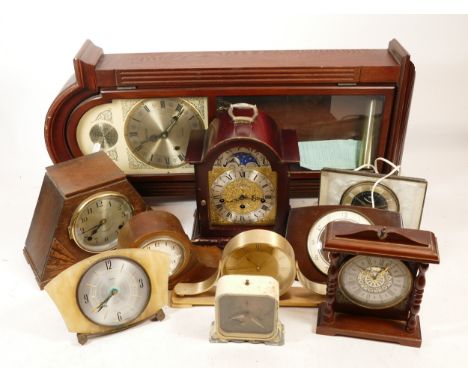 A collection of mid 20th century and later mantel clocks, having manual wind and quartz movements, in two boxes. (2)