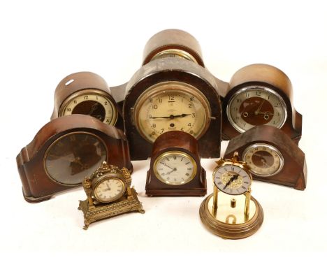 A collection of mid 20th century and later mantel clocks, having manual wind and quartz movements, in two boxes. (2)