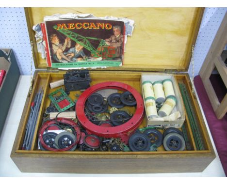 A Large Quantity of Post War Red and Green Meccano, with a significant amount of parts from Outfit No.9. playworn, presented 