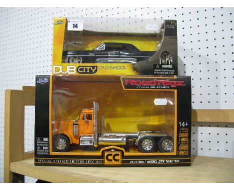 A Road Rigz 1:32nd Scale Diecast Model Peterbilt Model 379 Tractor, and a Jada Toys 1:24th Scale Diecast Model 1963 Cadillac 