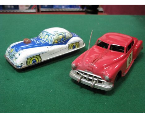 A 1950's Plastic Police Car, by Marx, friction drive, red plastic, 24cm long, plus a tinplate police car by PN of Western Ger