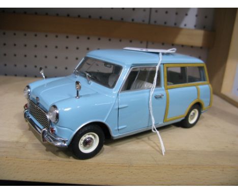 A Kyosho 1:18th Scale Diecast Model Austin Mini Countryman, pale blue in colour, passenger side wing mirror bent.