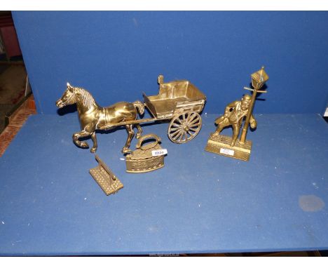 A small quantity of brass to include a horse and cart with carriage lamp, a gent holding up a lamp post, flat iron, etc.