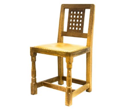 Robert Mouseman Thompson of Kilburn, a set of four Arts and Crafts style carved oak lattice back dining chairs, with leather 