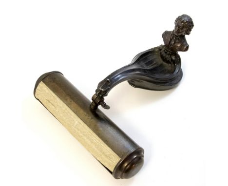 An Art Nouveau piano lamp or shelf light, naturalistic leaf form terminating in a lions head suspending a barrel lamp, surmou