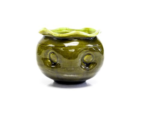 After Christopher Dresser, an Art Pottery majolica jardineire, probably Linthorpe, ovoid form with dimple decoration and crim