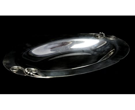 An Art Deco Danish silver plate dish , Dansk ForsA, circa 1929-1932, oval form with stylised blossom, after Georg Jensen, num