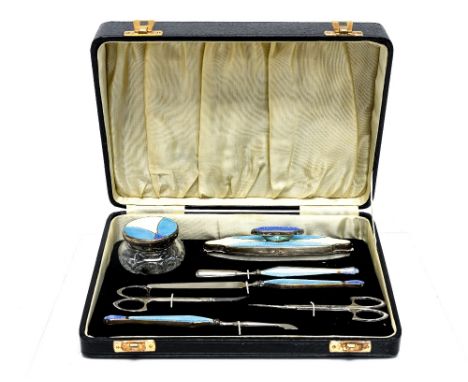 An Art Deco silver and enamel manicure set, blue, turquoise and cream guilloche enamelling in a Secessionist style, geometric