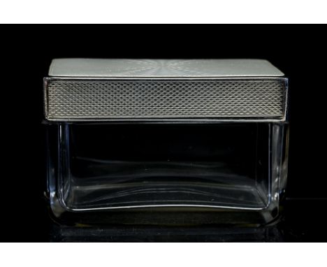 An Art Deco silver and guilloche enamelled top glass jar, rectangular section with cream sunburst enamel decoration, the edge