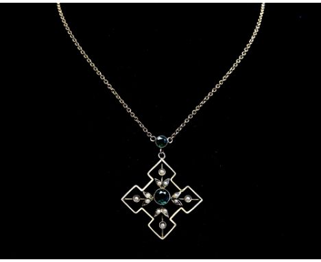 An Arts and Crafts 9 carat gold and seed pearl pendant on chain, in the Art Nouveau style, set with green stones, cross star 