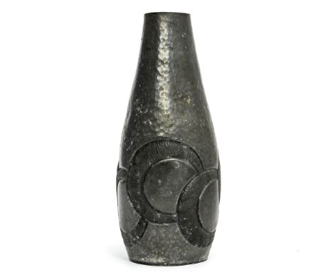 Rene Delavan for Etain Garanti, a French Art Deco pewter vase, bottle form, hand hammered and repousse decorated with interse